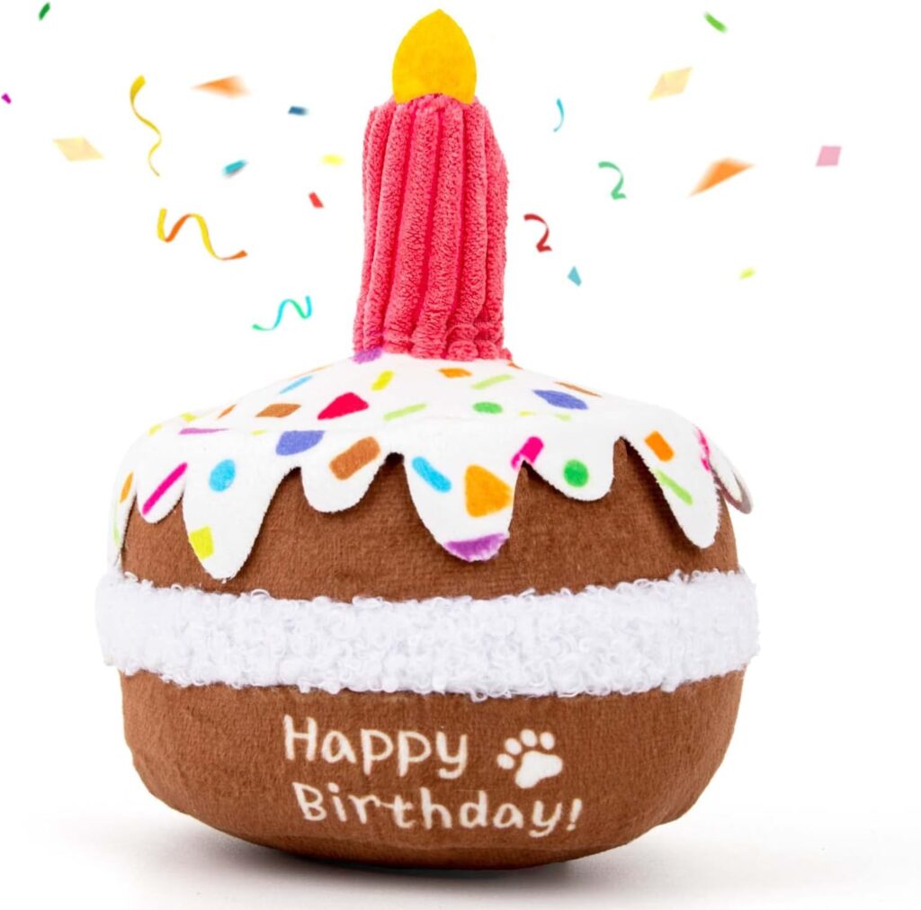 Plush dog birthday cake toy with candle, sprinkles and Happy Birthday design